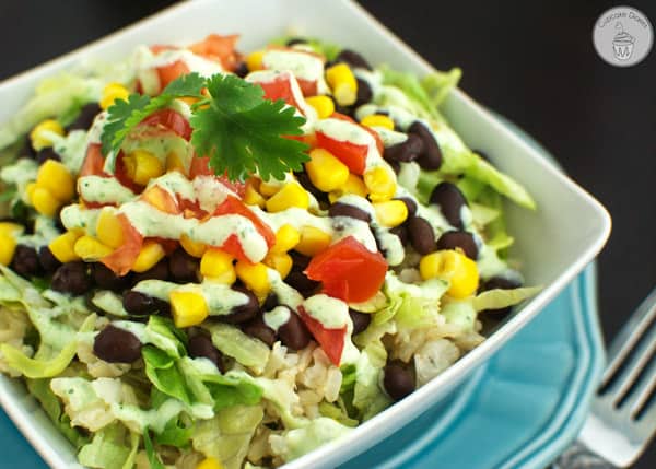 Burrito Bowls with Light Tomatillo Ranch Dressing and a fork.