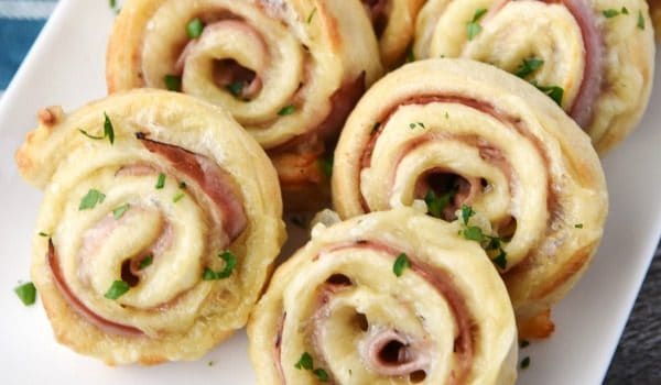 Easy Ham and Cheese Pinwheels - A ham and cheese sandwich rolled up into a fun pinwheel! They're easy to make and fun to eat.