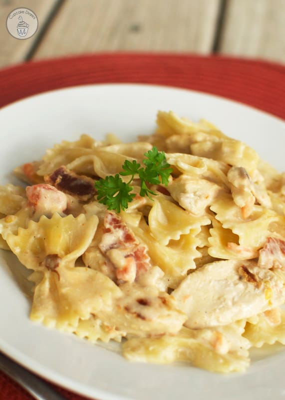 Copycat Johnny Carino's Bowtie Festival - Al dente bowtie pasta tossed with bacon, tomatoes, onions, and a creamy sauce. This is a Johnny Carino's copycat favorite!