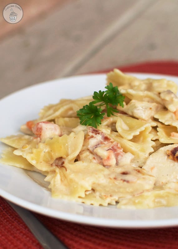 Copycat Johnny Carino's Bowtie Festival - Al dente bowtie pasta tossed with bacon, tomatoes, onions, and a creamy sauce. This is a Johnny Carino's copycat favorite!