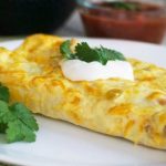 Chicken Enchiladas - Cheesy enchiladas filled with tender chicken and a creamy sauce. These are a family favorite!