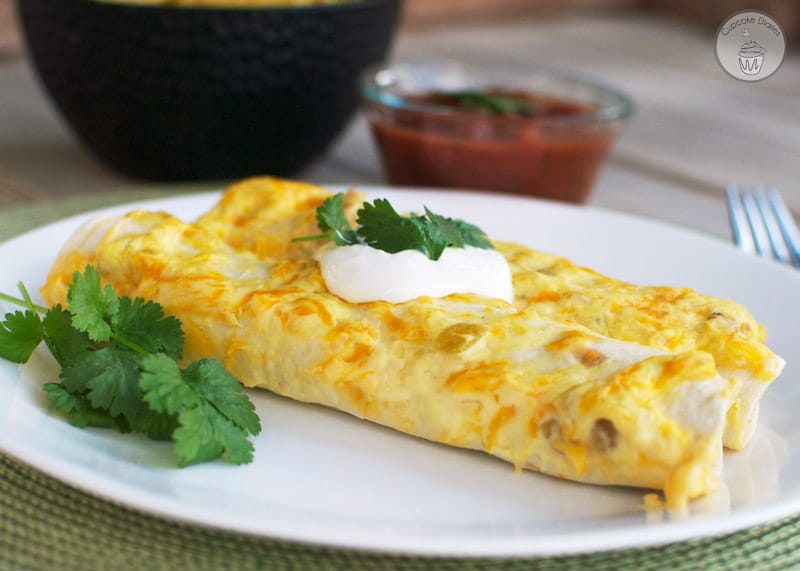 Chicken Enchiladas - Cheesy enchiladas filled with tender chicken and a creamy sauce. These are a family favorite!
