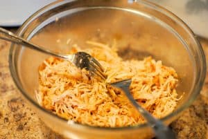 Copycat Garcia's Pollo Fundido Step 2 - Remove chicken from the crock pot and shred with two forks.