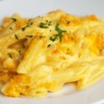 World's Best Mac and Cheese - Penne pasta combined with a delectable creamy cheese sauce and topped with a crunchy topping. This is the BEST mac and cheese!