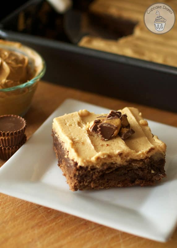 Perfectly moist and chewy chocolate brownies with chunks of peanut butter cups inside, topped with a smooth and creamy peanut butter frosting. Amazing!!