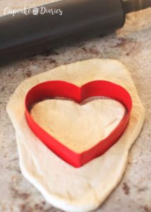 Mini Heart Pizzas - Cut out heart shapes and place on greased cookie sheet