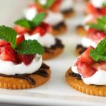 Chocolate and Cream Strawberry Snacks - Dark chocolate, whipped cream, and sweet strawberries topped on a RITZ® cracker. A perfect snack to satisfy a sweet craving! #PutItOnARitz #Ad