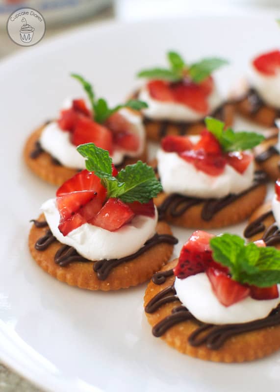 Chocolate and Cream Strawberry Snacks - Dark chocolate, whipped cream, and sweet strawberries topped on a RITZ® cracker. A perfect snack to satisfy a sweet craving! #PutItOnARitz #Ad