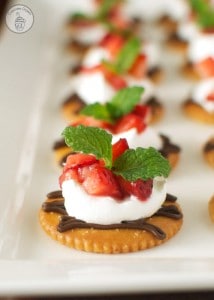 Chocolate and Cream Strawberry Snacks - Dark chocolate, whipped cream, and sweet strawberries topped on a RITZ® cracker. A perfect snack to satisfy a sweet craving! #PutItOnARitz #Ad