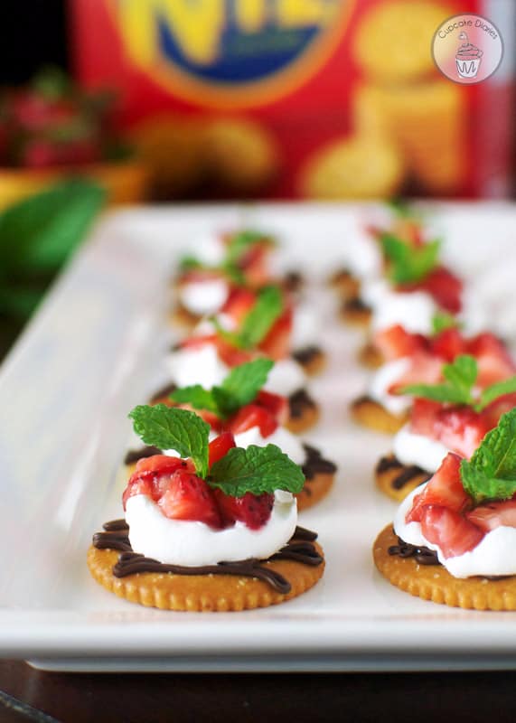Chocolate and Cream Strawberry Snacks -  Dark chocolate, whipped cream, and sweet strawberries topped on a RITZ® cracker. A perfect snack to satisfy a sweet craving! #PutItOnARitz #Ad