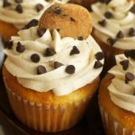 Chocolate Chip Cookie Dough Cupcakes - A delicious vanilla cupcake topped with chocolate chip cookie dough frosting with a cookie dough surprise in the center. These are one of my favorite cupcakes I've ever made!