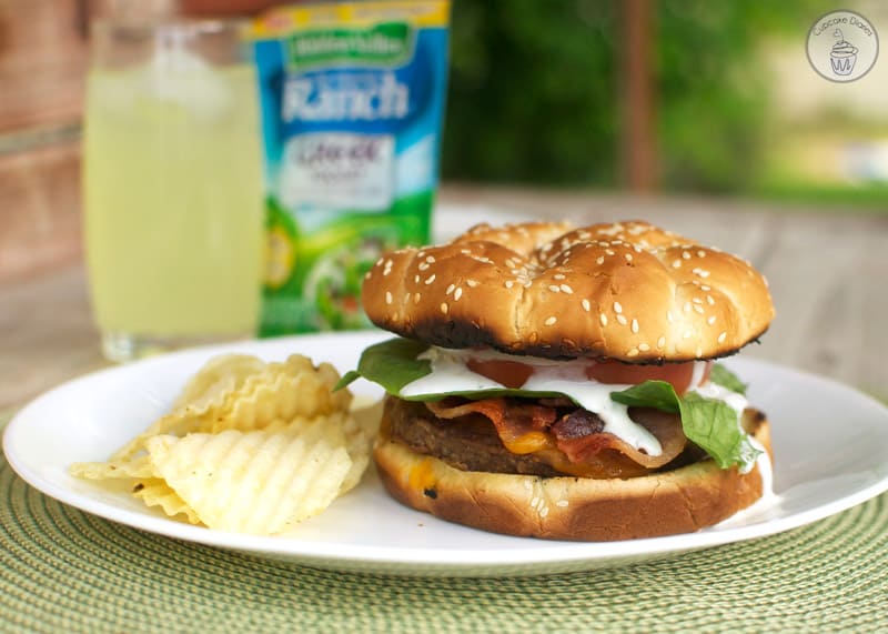 Bacon Ranch Burger - A juicy cheeseburger topped with crispy bacon and a tangy ranch dressing. Perfect for a summer BBQ! 
