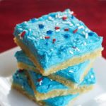 Your Fourth of July dessert table needs these Patriotic Sugar Cookie Bars! This is a perfectly chewy cookie bar that you will want to make all year long.