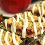 Strawberry Crumb Bars - A crispy cookie crust layered with sweet strawberries, buttery crumble, and a white chocolate glaze. A perfect summer dessert!