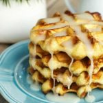 Easy Cinnamon Roll Waffles - You're going to love how easy it is to make these waffles! A fun twist on an ooey gooey cinnamon roll.
