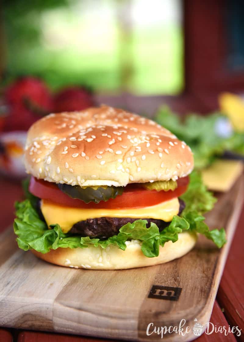 All-American Burger - A juicy beef burger is topped with America's favorite burger toppings! This burger is going to be at a lot of BBQ's this summer.