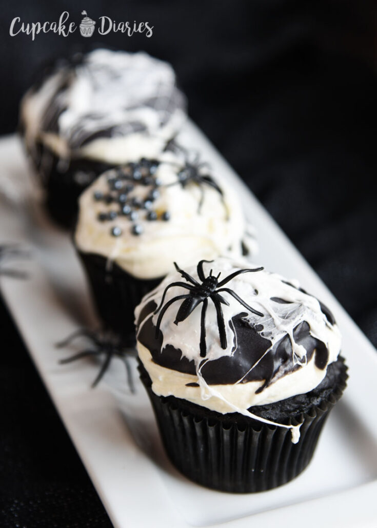 https://www.cupcakediariesblog.com/wp-content/uploads/2019/09/black-and-white-spider-web-cupcakes-735x1029.jpg