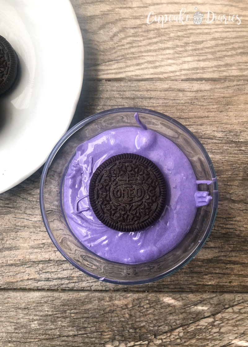 The first step to making these dipped Oreos is dipping the Oreos!