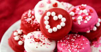 Homemade Dipped Oreos for Valentine's Day are so bright, fun, and easy to make! Package them up in cellophane bags for a simple and tasty valentine gift.