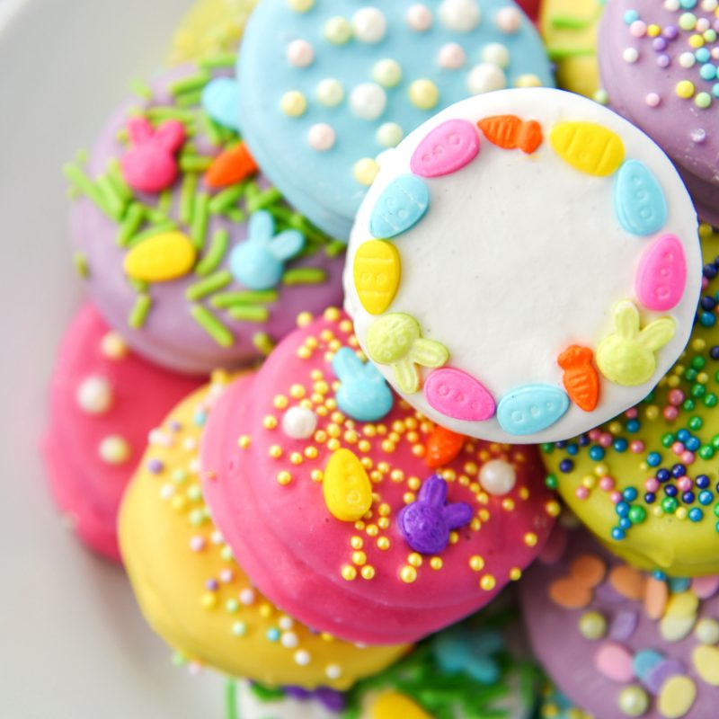 Oreo cookies dipped in bright colors and decorated for Easter!