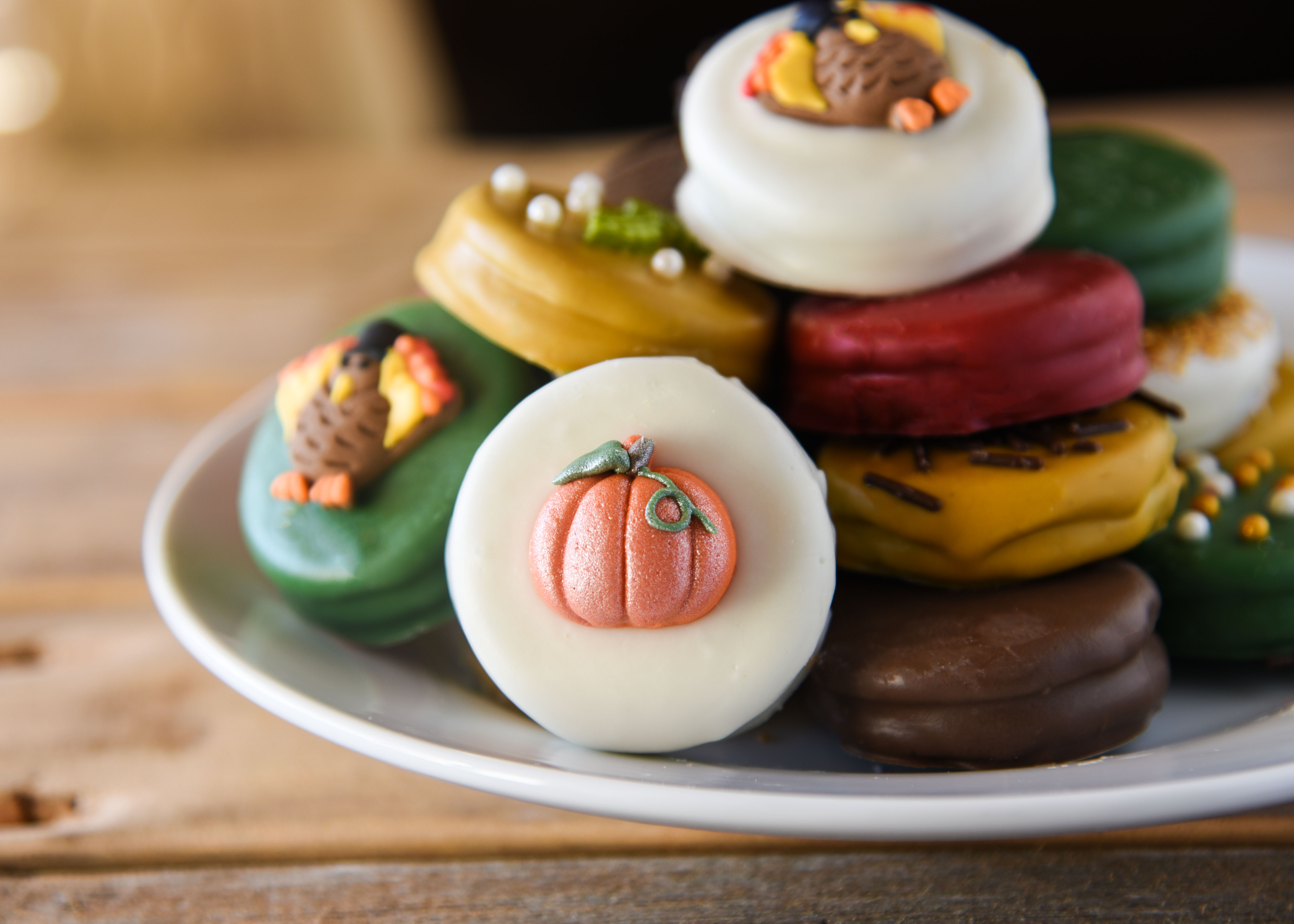 Oreos dipped in festive colors and decorated for Thanksgiving! A perfect treat for the dessert table.