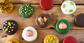 Oreos covered in chocolate topped with turkeys, pumpkins, and festive fall sprinkles!